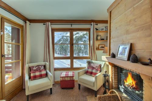 ARC 1950 - Appartement 10 personnes Duplex Cheminée - ski aux pieds - Sauna, Hammam, Jacuzzi, Piscine