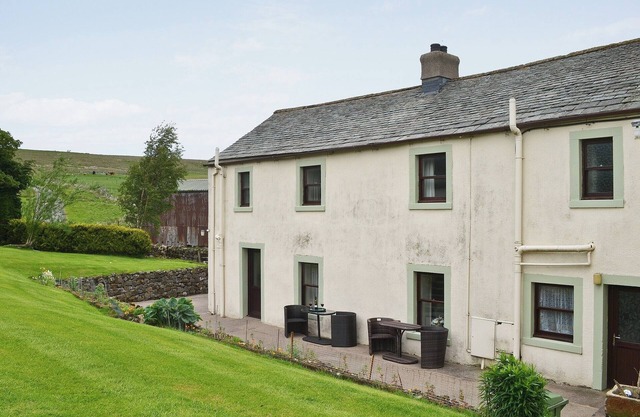 Attractive farm cottage with period features and views over fields and fells.