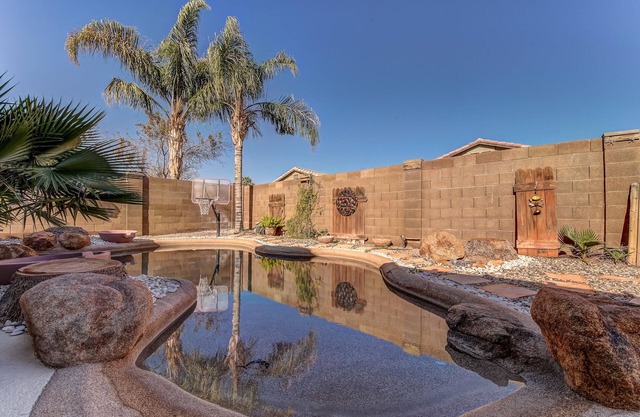 Backyard oasis with private solar heated pool, hot tub and tons of amenities!