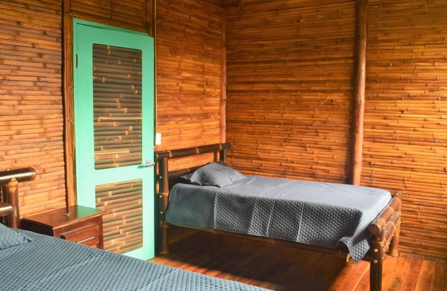 Bambu house, surrounded by nature, birds and waterfalls.