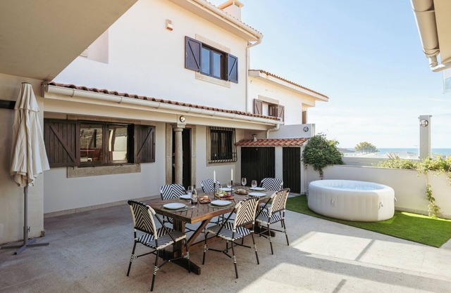 Beach Villa with Jacuzzi and Garage by HostWise