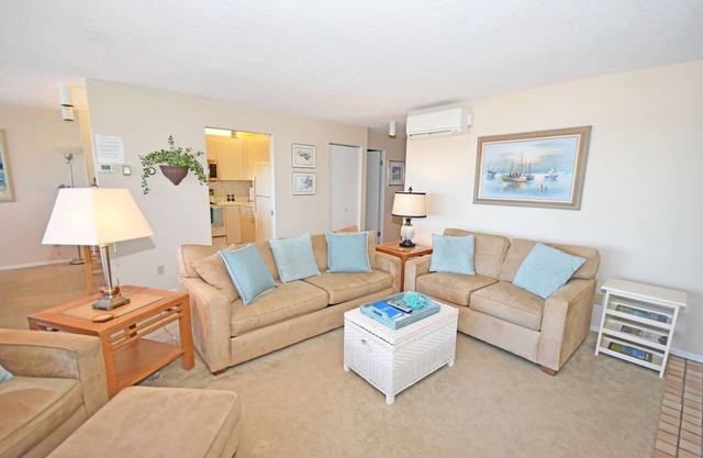 Beachfront condo with gorgeous Lake Michigan views, deck, fireplace, W/D, AC