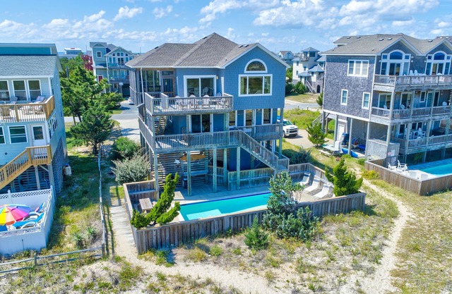 Beachfront getaway with ocean views, private pool, hot tub, bar, deck & foosball
