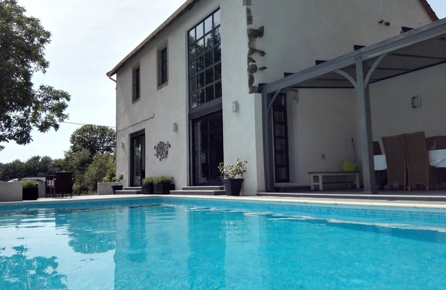 Beautiful modern villa with private pool surrounded by fields and forests