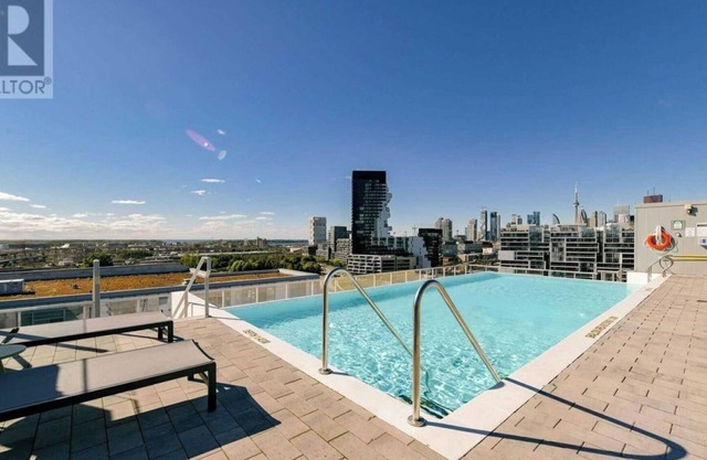 Beautiful corner unit with floor to ceiling windows in prime South Riverdale