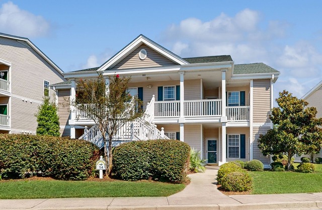 Beautiful dog-friendly coastal home close to beach, AC, and shared pool.
