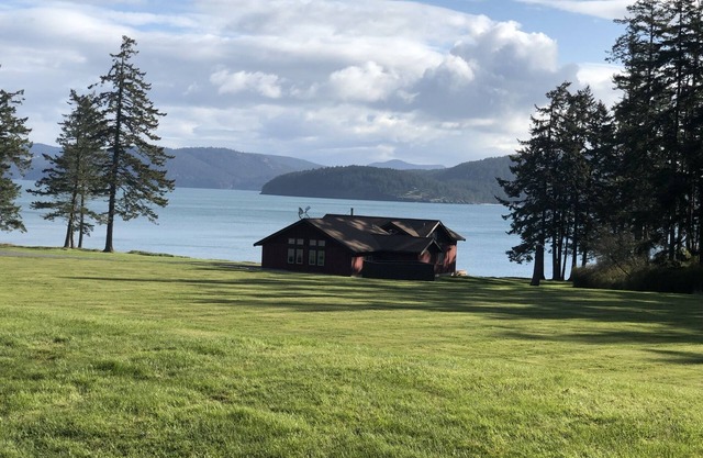 Beautiful farmhouse overlooking water with beach access on a private estate