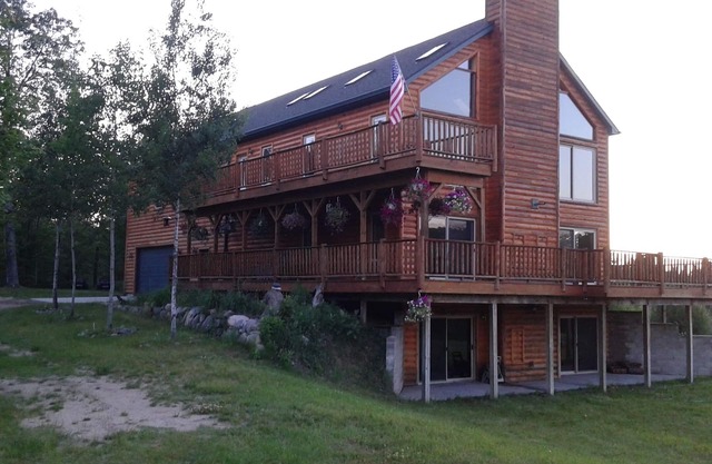 Beautiful Home and property on 50 acres next to golf, amusement park & trails.