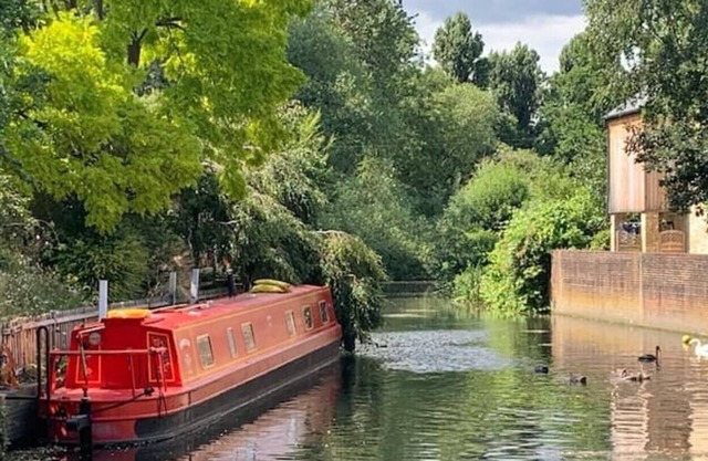Beautiful London narrowboat moored in private garden