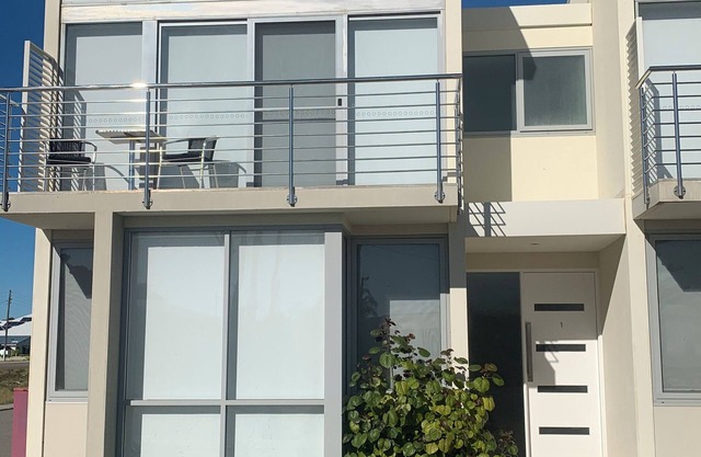 Beautiful modern three bedroom townhouse walking distance to the beach.