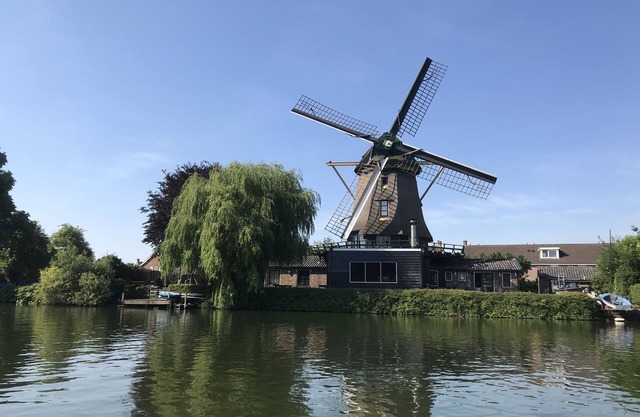 Beautiful original windmill along the riverside