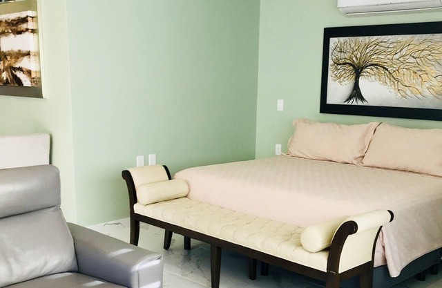 Beautiful suite with a full kitchen with amazing views of the beach, and forest