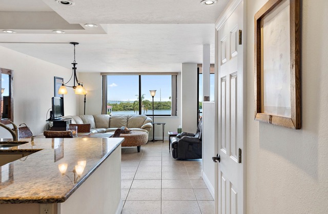 Beautiful updated 3rd floor condo with open floor plan and lovely water views