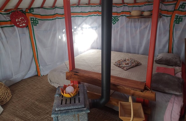 Bed and breakfast in a yurt between forest and meadow.