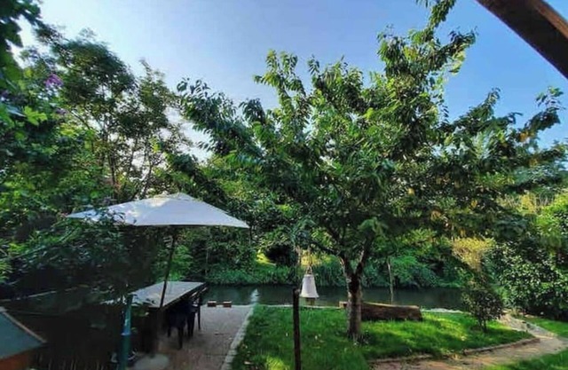 Between town & country (garden with river)