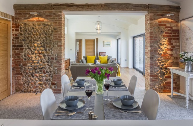 Big Sky Barn is a contemporary conversion of a 200 year old brick and flint barn