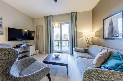 Boddenzeit - Moderne Ferienwohnung mit Nordbalkon, Wellnessbereich und Nähe zum Ostseestrand