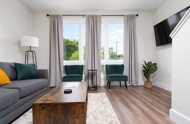 BRAND NEW downtown rooftop condo with water views