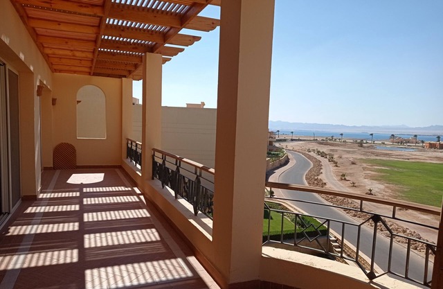 Breathtaking penthouse view of golf, rocky desert and Red Sea