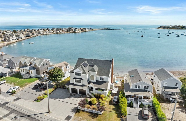 Breathtaking harbor views from spacious beachfront home.