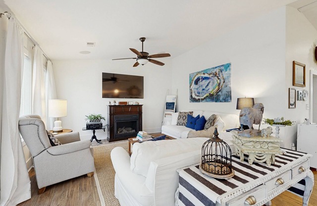 Breezy, renovated home with fenced yard, front porch & lovely living spaces