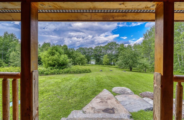 Bright three-level home with water views, jetted tub, firepit, and pool table