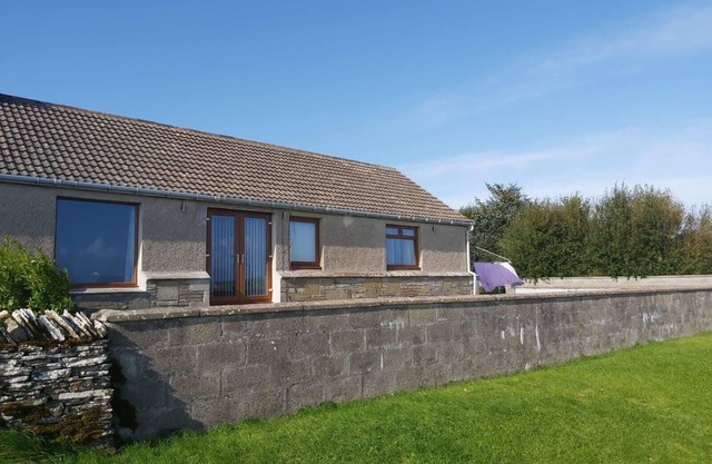 Bungalow with sea-view, near small town of Thurso.