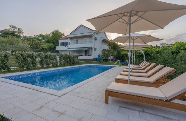 Captivating 4BD Villa with Outdoor Pool and Garden