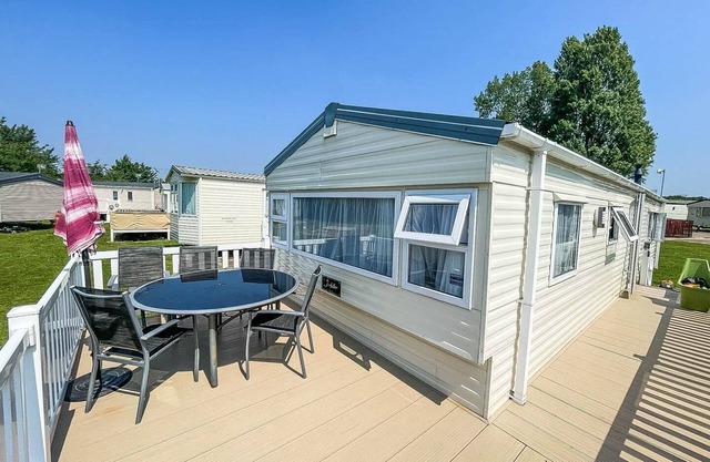 Caravan with large decking at Coopers Beach Holiday Park ref 49036TS