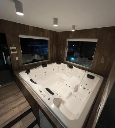 Casa agradável em frente a praia com jacuzzi/spa