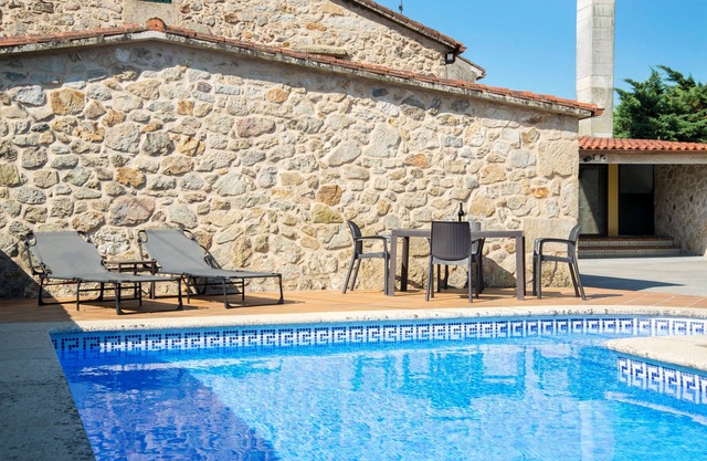 Casa Belai in a rural setting with swimming pool, barbecue area and fireplace lounge.