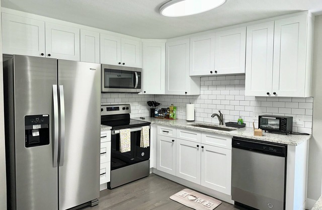 Central 5-BR Retreat with Basement Kitchenette & Convenient Freeway Access
