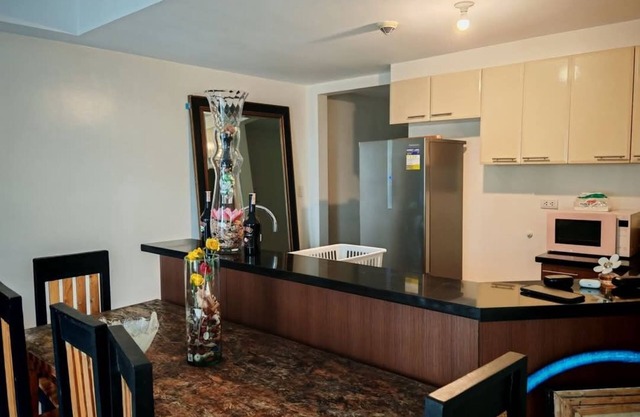 Charming 1 bedroom condo in delightful Taguig with AC, WiFi, fitness room