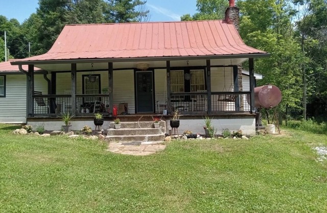 Charming 2-bedroom historic house set on 2 acres with a meandering stream.