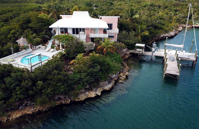 Charming and Secluded Home on the Bay with Fresh Water Pool, Dock, Views.