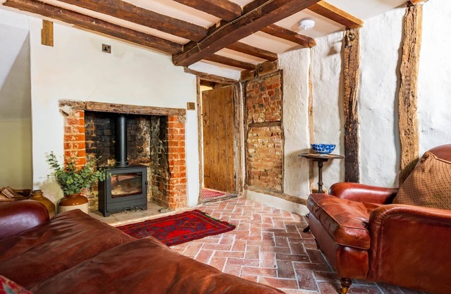Charming medieval cottage courtyard garden and wood burner in serene Kersey