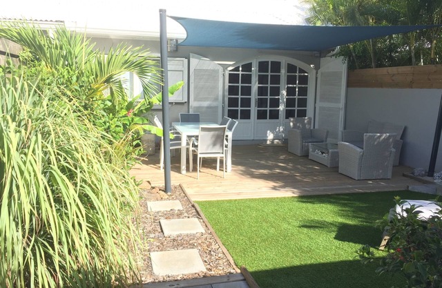 Charming outbuilding with large shaded terrace in private garden