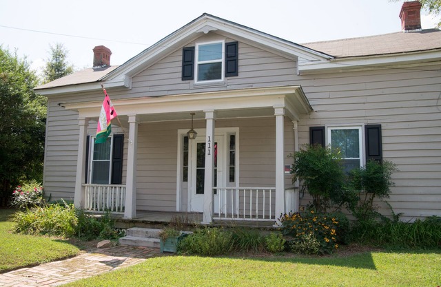 Charming restored Victorian Farmhouse and cottage on a large rural lot.