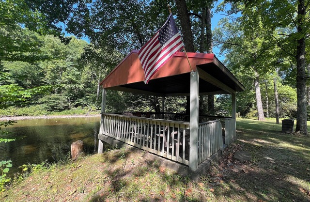Charming riverfront home with beautiful views, hot tub and game room. Fishing!