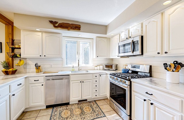 Charming tree-lined home with outdoor games, firepit, grill, W/D, & AC