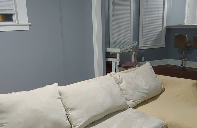 Cheerful 3 bedrooms residential home. 2 rooms has beds. 3rd room is home office.