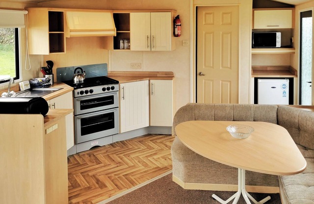 Comfortable and spacious 12ft-wide caravan with one double and two twin.