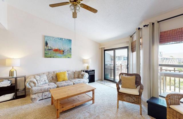 Comfortable townhome steps from beach with pool access, balcony, & W/D
