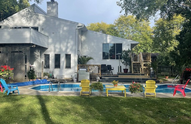 Contemporary home in quiet neighborhood with pool & great back yard close to all