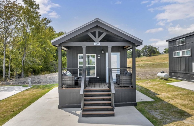 Cottage with Bunk Beds - Includes 1 queen bed in the master, 2 bunk beds and 1 queen bed in the loft. A fully equipped kitchen, dining area, private bath and shower, TVs, Wifi, all utilities, access to all resort amenities. This cottage is pet friend