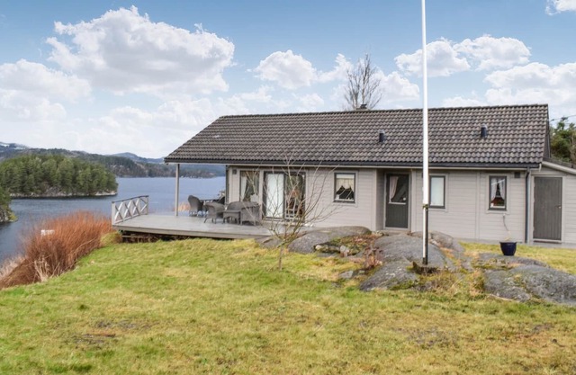 Cottage with large terrace and beautiful view over the Grindafjord.