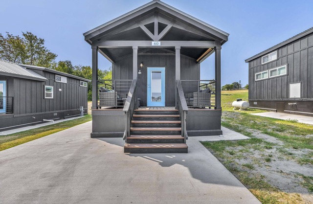 Cottage with Loft - Pet Friendly - Includes 3 queen beds (one in master and 2 in loft), a fully equipped kitchen, dining area, private bath and shower, TVs, Wifi, all utilities, access to all resort amenities. This cottage is pet friendly.