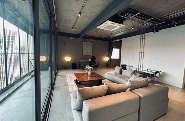 Cozy loft-style rooms, private baths, free Wi-Fi, A/C, and shared spaces.