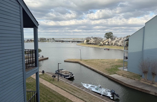 Cozy 2-bedroom condo on the water, with community pool and fitness center.