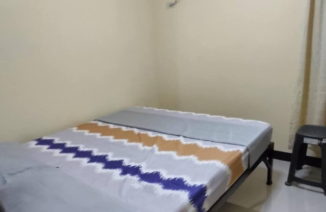 Cozy 2-bedroom lodge with WiFi, AC in charming Bagac